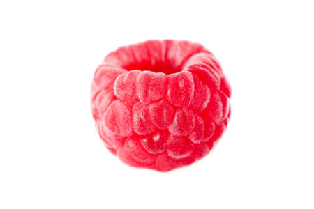 One ripe red raspberry isolated on white background close-up.の写真素材