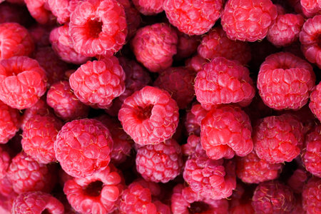 Background of ripe red raspberries.