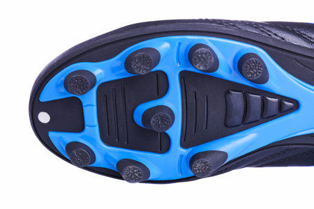 Leather football boots with spikes isolated on white background close-upの写真素材