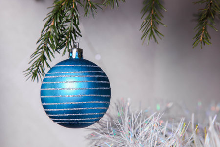 Blue ball on Christmas tree close-up.の写真素材