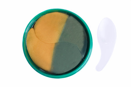 Gold green hydrogel eye patches isolated on white background.の写真素材