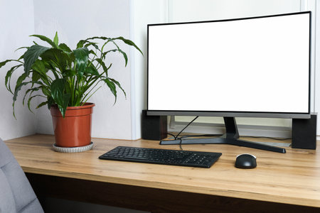 Monitor on wooden table in the room. Workplace.