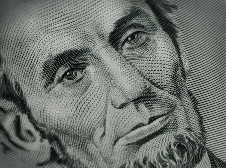 close up of Abraham Lincoln on five dollar billの写真素材