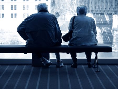 elderly couple sitting togetherの写真素材