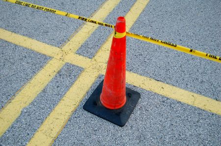 yellow taped fire line with cone - do not crossの写真素材
