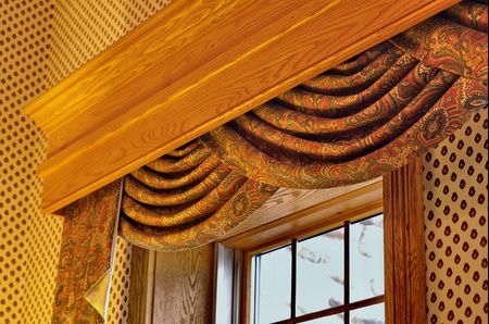 window treatment with swag curtain and corniceの写真素材