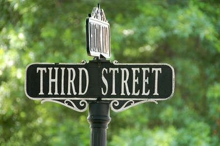 third street sign at intersectionの写真素材