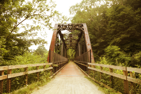 Old railway bridge converted to walking and biking pathの写真素材