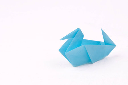 Blue Origami duck isolated on white backgroundの写真素材