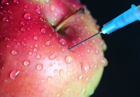 Apple injection. genetically modified foods.の写真素材