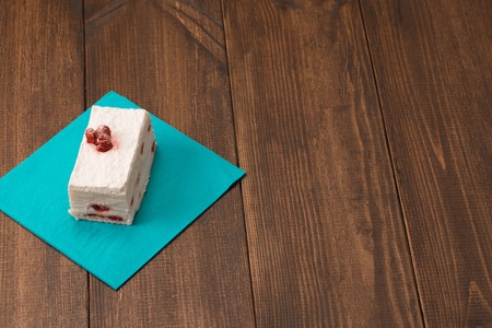 cake with fresh cherry on wooden backgroundの写真素材