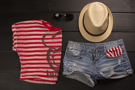 hipster clothes and accessories on a wooden backgroundの写真素材