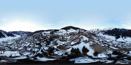 Winter landscape with mountain lake under evening sky