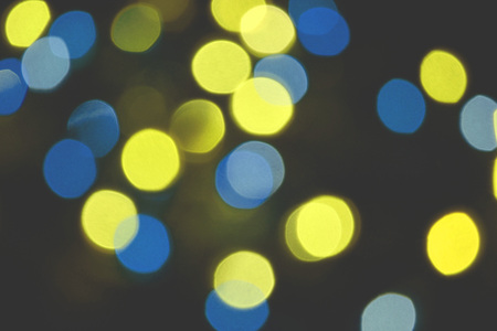 Colorful lights bokeh background, Chrismas lights bokeh. Colorful abstract background. Blurred and glowing lights. Boceh lens effect from lighting spots.の写真素材