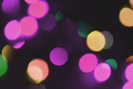 Colorful lights bokeh background, Chrismas lights bokeh. Colorful abstract background. Blurred and glowing lights. Boceh lens effect from lighting spots.の写真素材