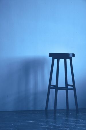 Classic blue color high stool. Monochrome background. Copy space.の写真素材