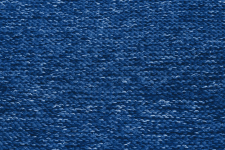 Classic blue colour monochrome texture knitted fabric. Blue knitted Jersey as textile background....