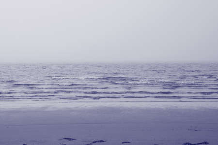 Very peri toned sea beach. North sea.の写真素材