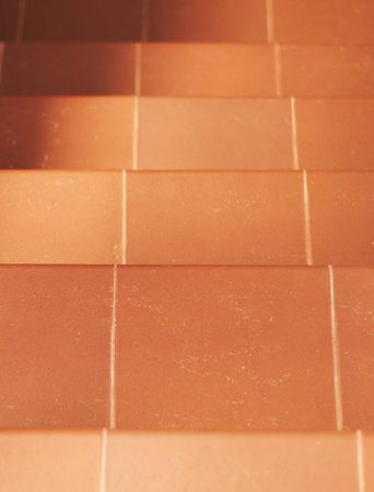 Several stairs made of brown tiles