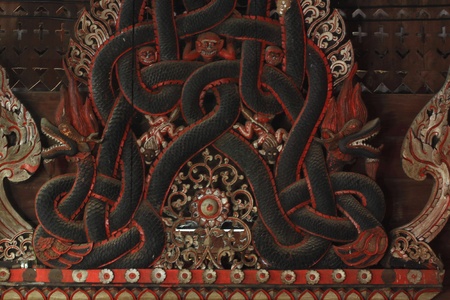 The ancient carvings wood of temple in thailandの写真素材