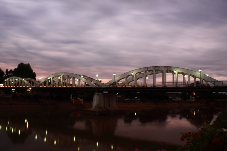 The overcast sky day at the Ratsadaphisak Bridge,Lampang,Thailandの写真素材