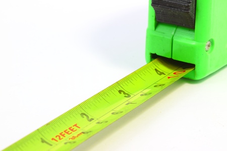 Old measuring tape with white backgroundの写真素材