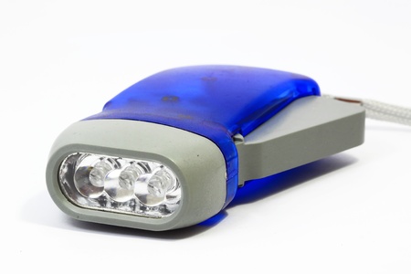Hand-pressing Flashlight for simply shake to recharge on white backgroundの写真素材
