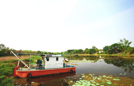 Old boat in the river of Thailand