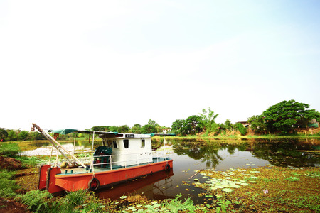Old boat in the river of Thailandの写真素材