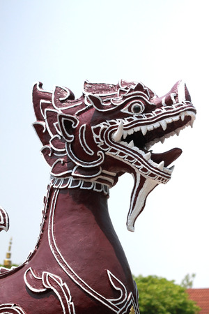 Red lion in front of Wat Phra That Hariphunchai: Lampoon, Thailand.の写真素材
