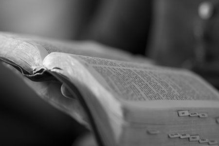A close-up of a christian woman reading the bible 