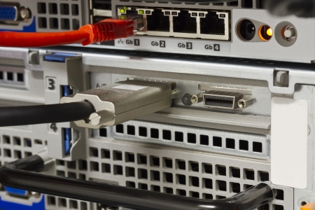 Close up of SCSI   SAS and ethernet network on rack servers  Shot in a datacenter の写真素材