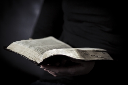 A close-up of a christian woman reading the bible  Shot with Canon 85mm 1 2L  Very shallow depth of fields の写真素材