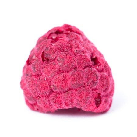 Close up of a dry organic raspberry on white background の写真素材