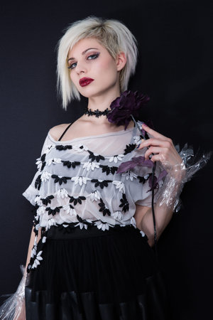 Rocker girl with japanese inspired street fashion clothing. Studio shot.の写真素材