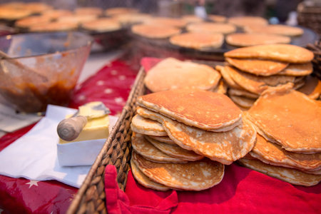 Svele or sveler fried outdoor at a marked. They bear some resemblance to American pancakes, but are...
