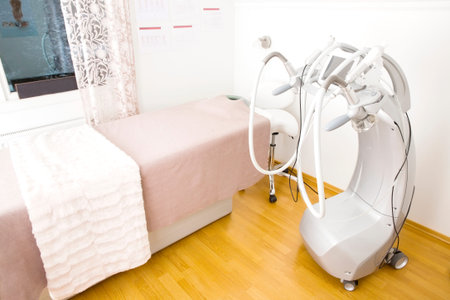 Client treatment room at a professional non-surgical full body shape and skin lift clinic. Advanced technology for lipo reduction, laserporation, radiolift and microdermabrasion.の写真素材