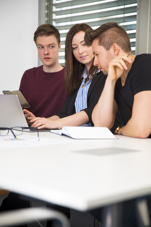 Business People Working At Desk In Officeの写真素材