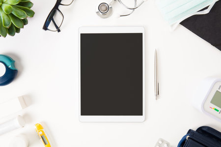 Medical Equipment Arranged By Digital Tablet On Table