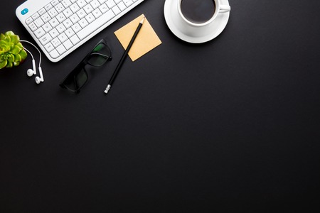 Keyboard With Coffee Cup And Office Supplies On Gray Deskの写真素材