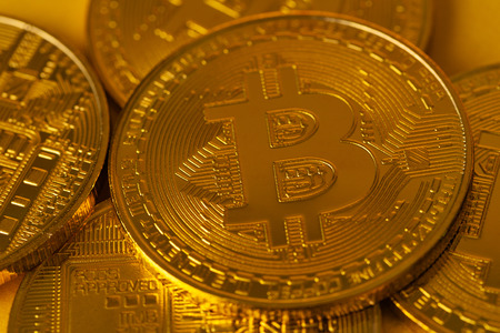 Top view closeup photo of many gold bitcoinsの写真素材