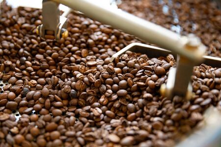 Close-up of Raw Coffee Beans In Roaster Machineの写真素材