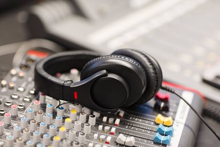 Closeup of headphones on Sound Mixer In Professional Radio Studioの写真素材