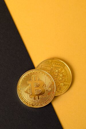 Bitcoins Crypto Currency Coin On Gold And Black Backgroundの写真素材