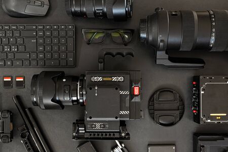 Top View of a Creative Filmmakers Office Desk with Lined up Camera and Gearの写真素材