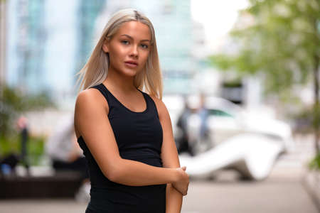 Portrait of a blonde young woman fitness model looking at cameraの写真素材