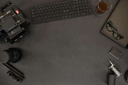 Overhead of digital tablet and filming equipment with coffee on tableの写真素材