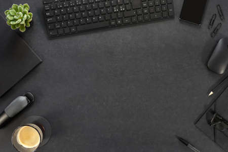 Computer Keyboard With Eyeglasses And Office Supply On Gray Deskの写真素材