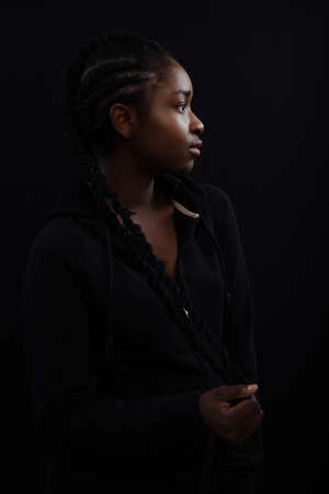 Confident woman with dark skin and cool attitude wearing hoodyの写真素材