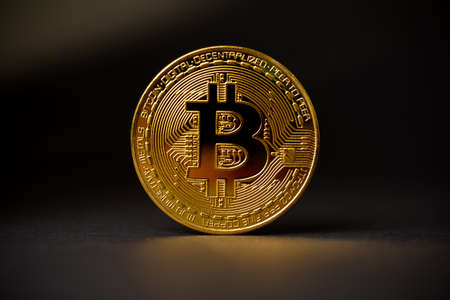 Gold Bitcoin Crypto Currency On Black Backgroundの写真素材